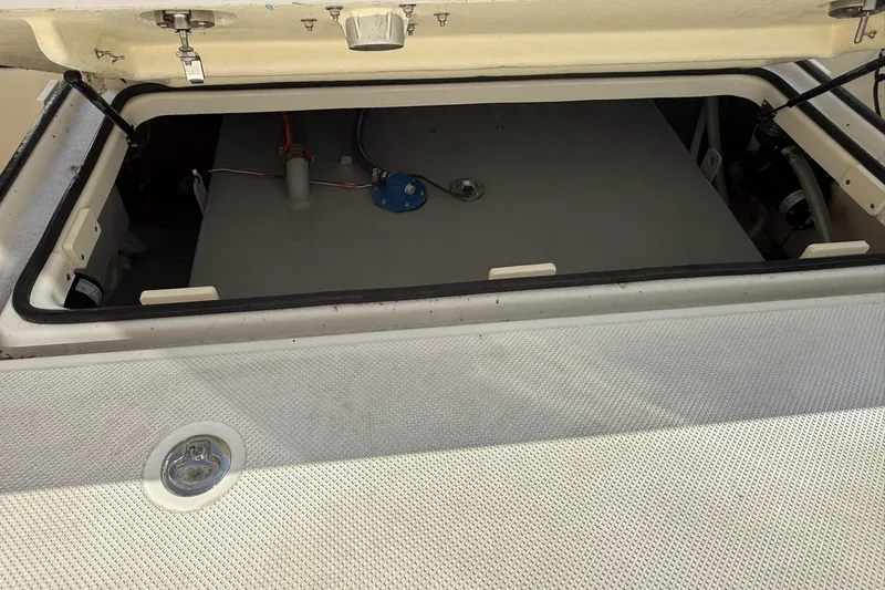 Slide: The Image of Open storage compartment on 2024 Bayliner Trophy T25 Pilothouse boat. - 30