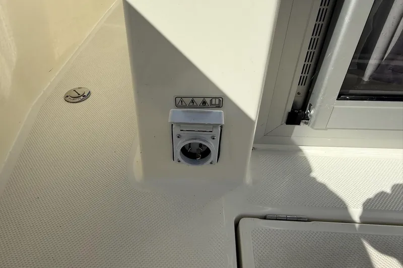 Slide: The Image of 2024 Bayliner Trophy T25 Pilothouse deck with utility outlet and hatch. - 32