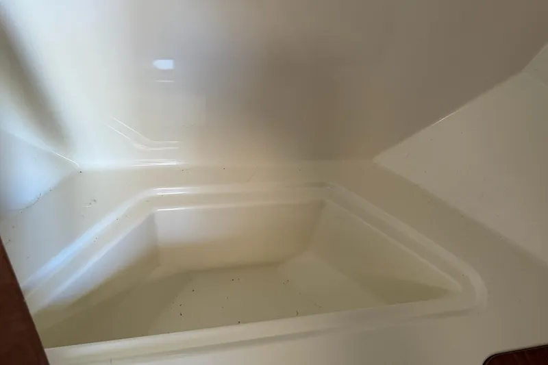 Slide: The Image of 2024 Bayliner Trophy T25 Pilothouse interior compartment detail. - 58