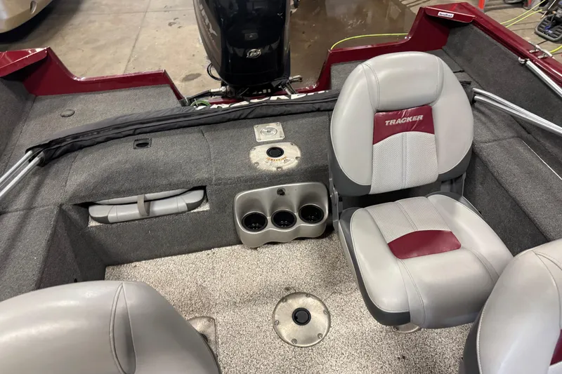 Slide: The Image of 2014 Tracker Pro Guide V-175 Combo boat interior with seating and cup holders. - 11