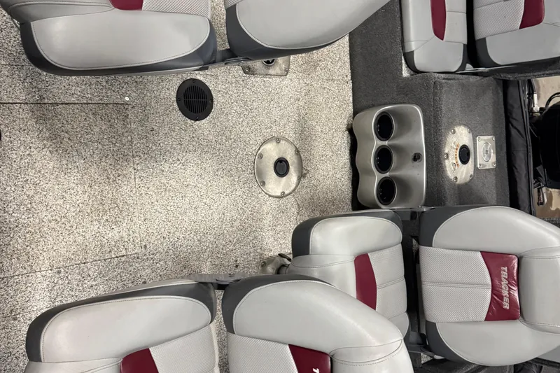 Slide: The Image of Interior of a 2014 Tracker Pro Guide V-175 Combo boat with seating and cup holders. - 15