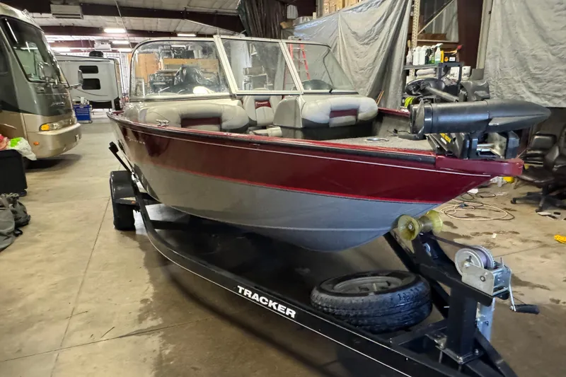 Slide: The Image of 2014 Tracker Pro Guide V-175 Combo boat on trailer in garage setting. - 2
