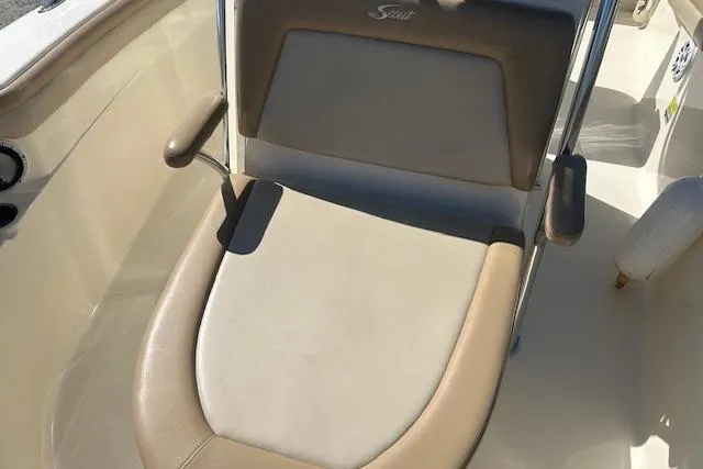Slide: The Image of 2022 Scout 215 XSF boat seat with beige and brown upholstery. - 16