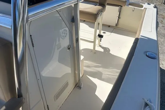 Slide: The Image of 2022 Scout 215 XSF boat interior with seating and storage area. - 20