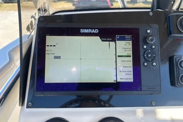 Slide: The Image of Simrad display on 2022 Scout 215 XSF boat dashboard showing navigation data. - 24