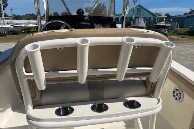 Slide: The Image of 2022 Scout 215 XSF boat with rod holders and cup holders on the deck. - 26