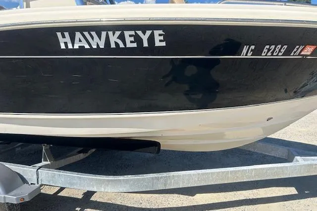 Slide: The Image of 2022 Scout 215 XSF boat named "Hawkeye" on trailer, side view. - 3