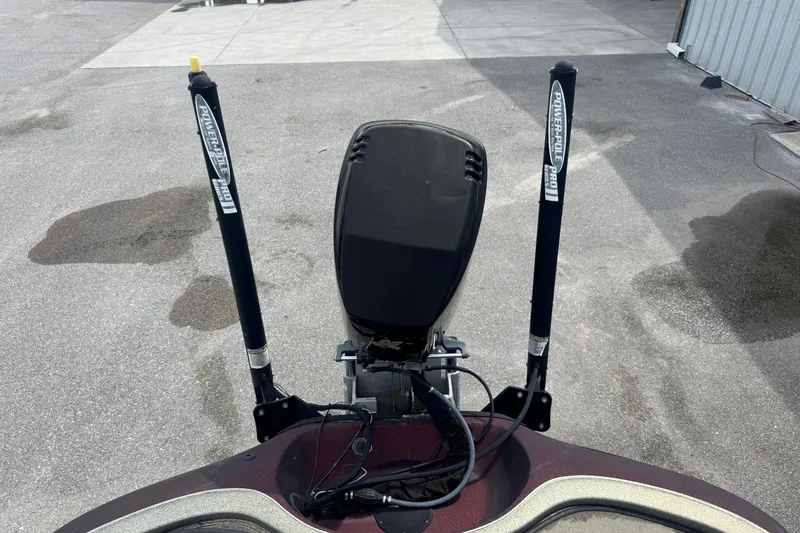 Slide: The Image of 2000 Ranger 520DVX Comanche boat with Power-Pole Pro anchors on concrete surface. - 15