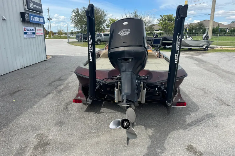 Slide: The Image of Rear view of a 2000 Ranger 520DVX Comanche boat with outboard motor and Power-Pole anchors. - 7