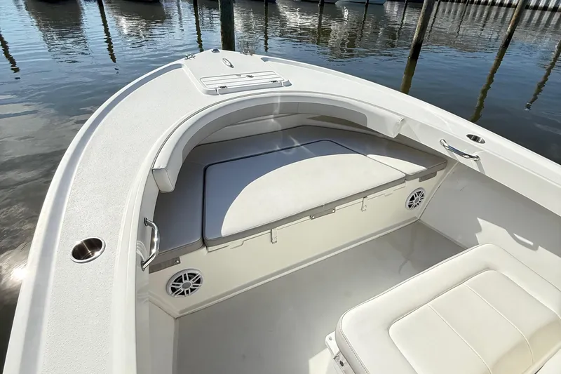 Slide: The Image of 2020 Parker 2100 Special Edition boat interior with cushioned seating and cup holders. - 19