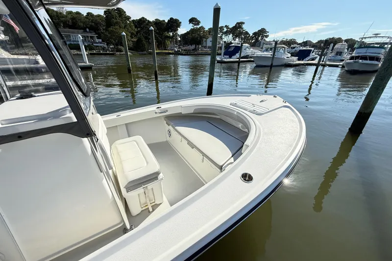 Slide: The Image of Parker 2100 Special Edition 2020 boat docked in a serene marina setting. - 25