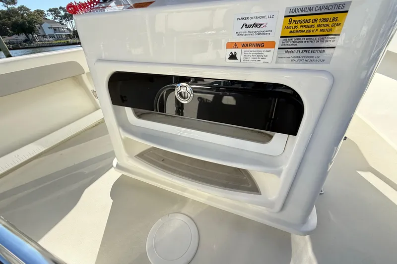 Slide: The Image of 2020 Parker 2100 Special Edition boat docked at marina under clear blue sky. - 36