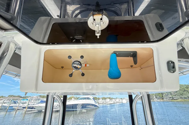 Slide: The Image of 2020 Parker 2100 Special Edition boat on a scenic river with clear skies. - 38