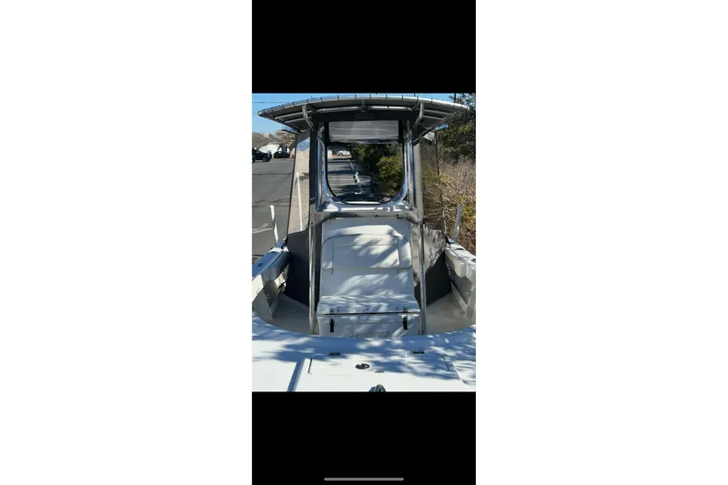 Slide: The Image of 2020 Parker 2100 Special Edition boat, center console view, parked outdoors. - 44