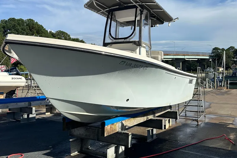 Slide: The Image of 2020 Parker 2100 Special Edition boat on dock, side view, sunny day. - 7