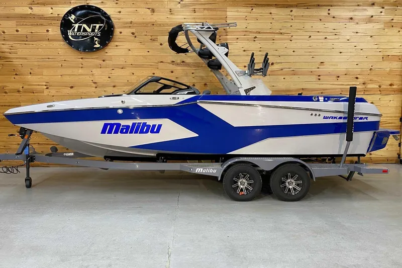 The Image of 2024 Malibu Wakesetter 23 MXZ boat on trailer in showroom. - 1
