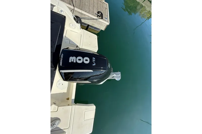 Slide: The Image of Bayliner Trophy T25 Pilothouse 2024 with Mercury 300 V8 engine at dock. - 13