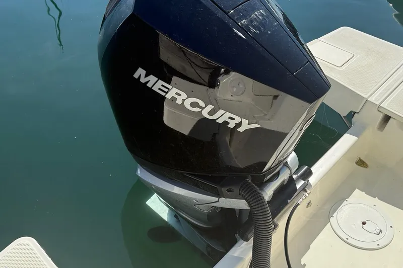 Slide: The Image of 2024 Bayliner Trophy T25 Pilothouse with Mercury outboard engine in water. - 16