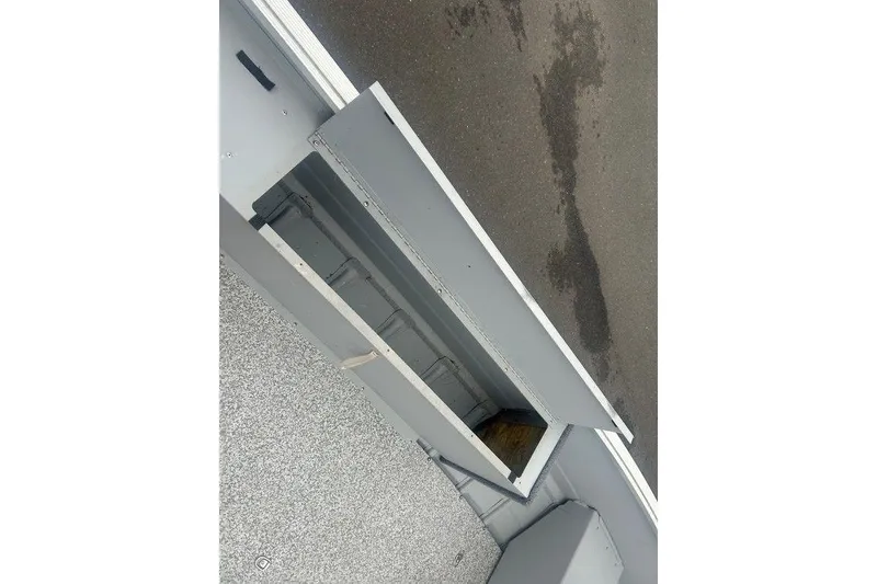 Slide: The Image of Open storage compartment on a 2020 MirroCraft 3673 boat, showing interior details. - 13