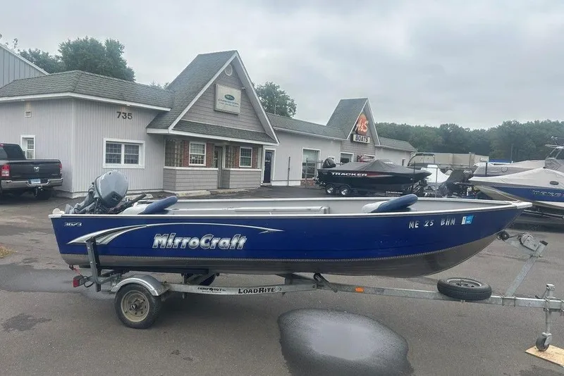 Slide: The Image of 2020 MirroCraft 3673 boat on trailer outside dealership, overcast day. - 4