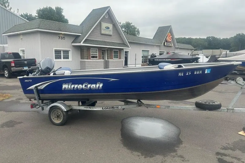 Slide: The Image of 2020 MirroCraft 3673 boat on trailer, parked outside a building. - 5