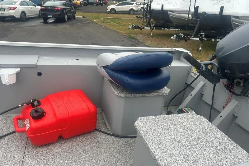 Slide: The Image of 2020 MirroCraft 3673 boat interior with red fuel tank and blue seat. - 7