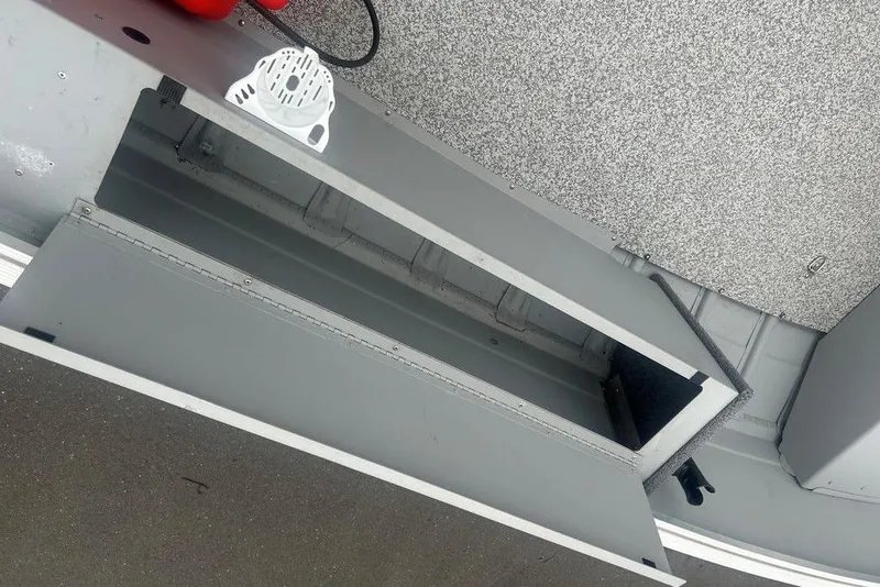 Slide: The Image of Open storage compartment on a 2020 MirroCraft 3673 boat, showing interior details. - 9