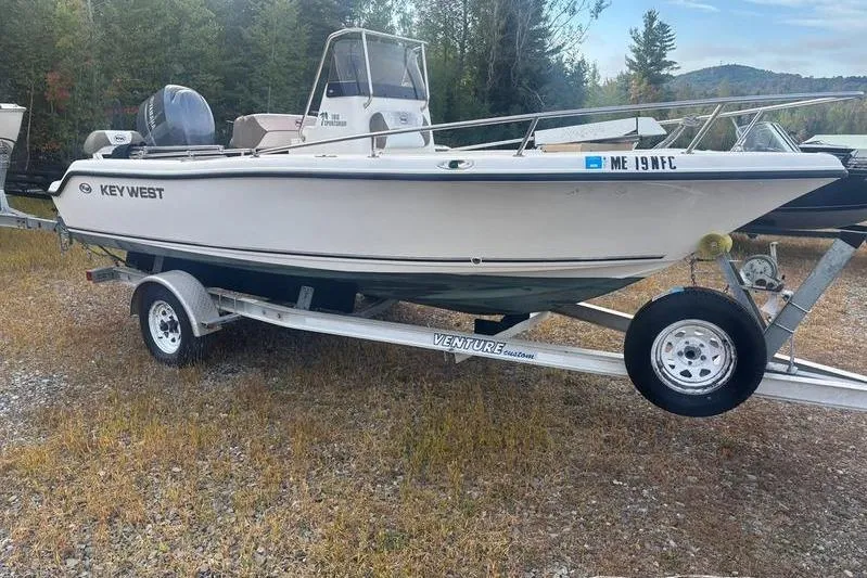 The Image of 2013 Key West 186 Center Console boat on trailer, parked outdoors. - 0