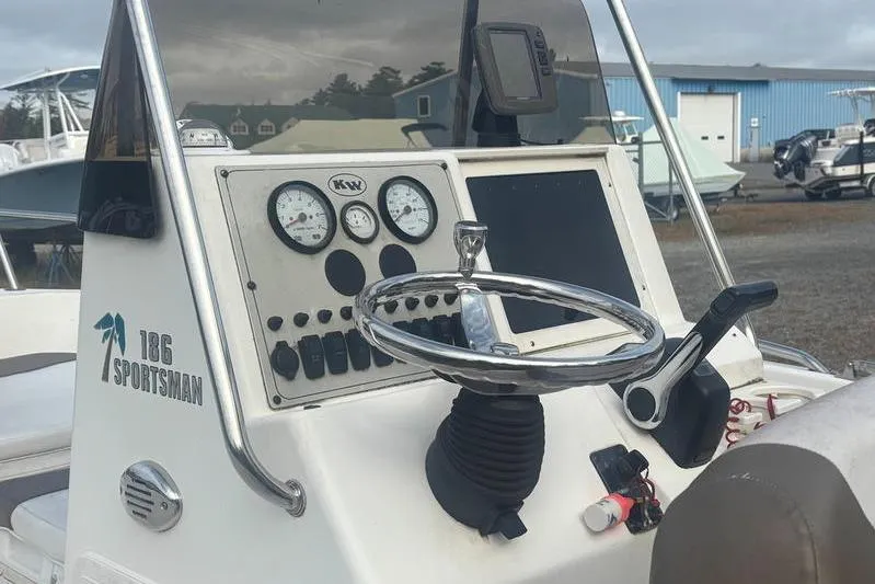 Slide: The Image of Center console of 2013 Key West 186 Sportsman boat with steering wheel and gauges. - 10