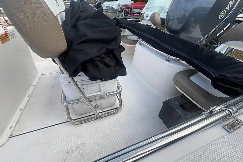 Slide: The Image of 2013 Key West 186 Center Console boat interior with seating and Yamaha engine. - 4