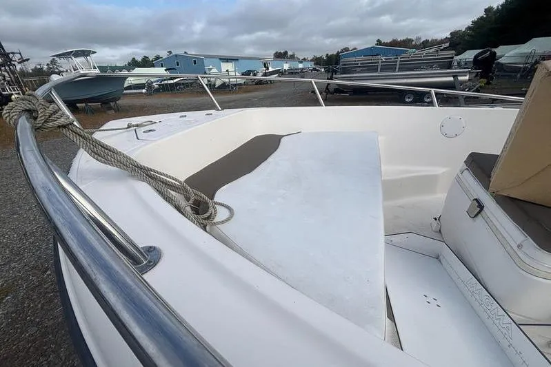 Slide: The Image of 2013 Key West 186 Center Console boat docked, featuring spacious deck and railing. - 5