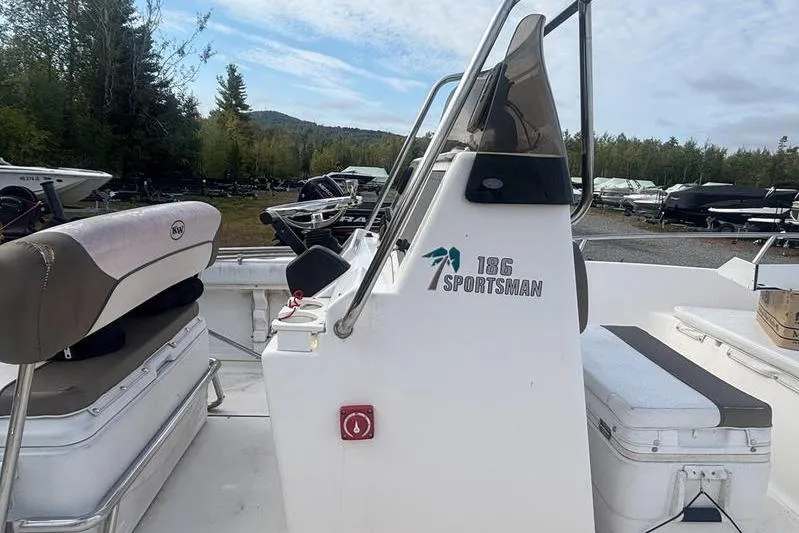 Slide: The Image of 2013 Key West 186 Center Console boat with seating, outdoors in a wooded area. - 6