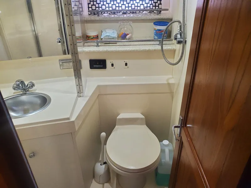Slide: The Image of Bathroom in 2000 Carver 356 Aft Cabin Motor Yacht with sink and toilet. - 26