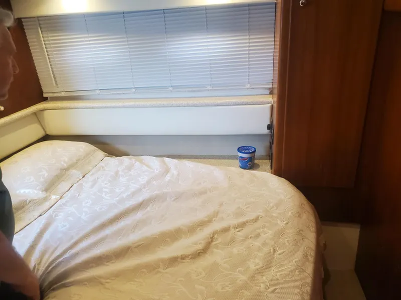 Slide: The Image of Interior of 2000 Carver 356 Aft Cabin Motor Yacht with bed and window blinds. - 36