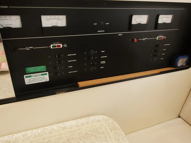 Slide: The Image of Control panel of 2000 Carver 356 Aft Cabin Motor Yacht, featuring gauges and switches. - 22