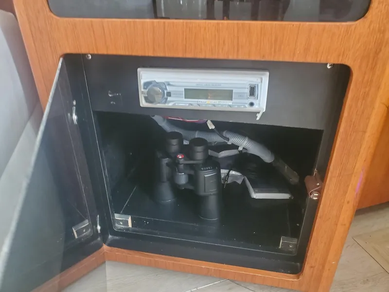 Slide: The Image of Cabinet with stereo system and binoculars on Carver 356 Aft Cabin Motor Yacht, 2000 model. - 35