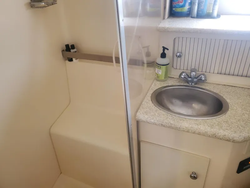 Slide: The Image of Bathroom interior of 2000 Carver 356 Aft Cabin Motor Yacht with sink and shower. - 38