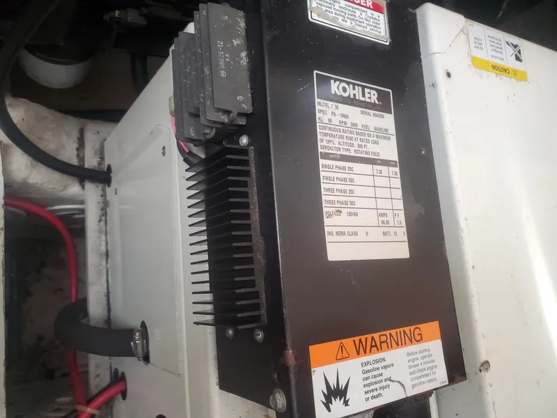 Slide: The Image of Kohler generator in a 2000 Carver 356 Aft Cabin Motor Yacht engine room. - 44
