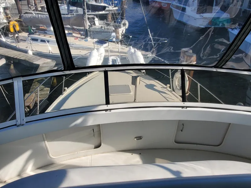 Slide: The Image of 2000 Carver 356 Aft Cabin Motor Yacht docked at marina, view from helm. - 5
