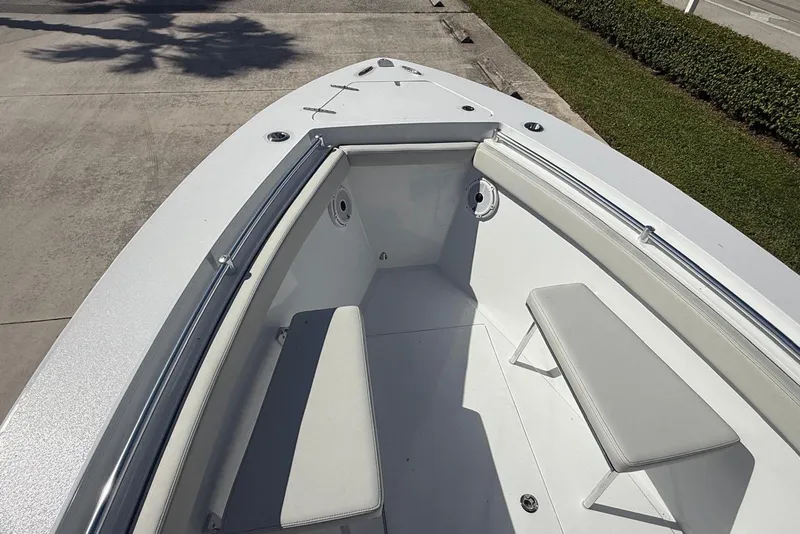 Slide: The Image of 2001 Contender 21 Open boat interior with seating, docked on a sunny day. - 10