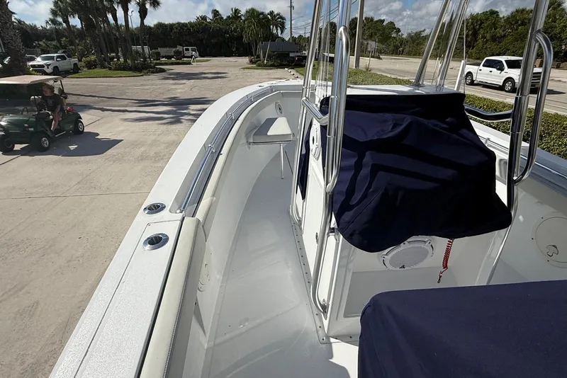 Slide: The Image of 2001 Contender 21 Open boat interior with covered console, parked outdoors. - 12