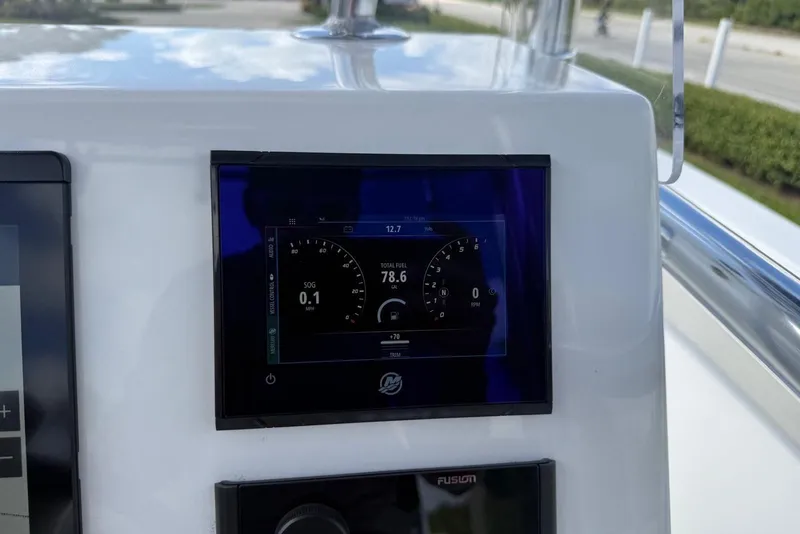 Slide: The Image of Dashboard of a 2001 Contender 21 Open boat showing digital gauges and controls. - 6