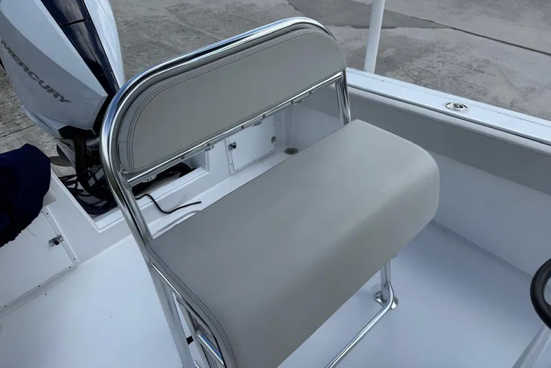 Slide: The Image of 2001 Contender 21 Open boat interior with Mercury engine and cushioned seating. - 8