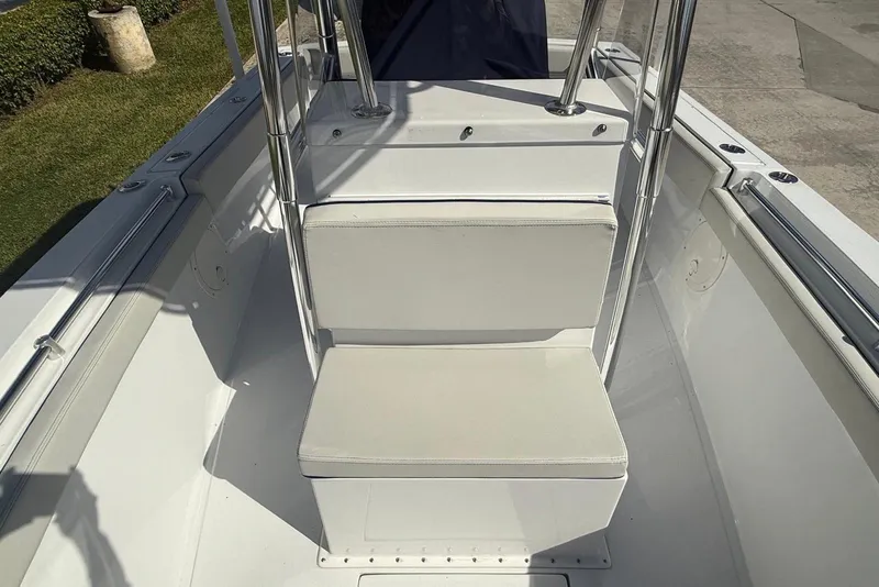 Slide: The Image of 2001 Contender 21 Open boat interior with white seating and stainless steel railings. - 9