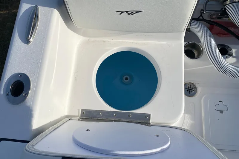 Slide: The Image of 2024 Tidewater 180 CC Adventure boat interior with livewell and storage compartment. - 11
