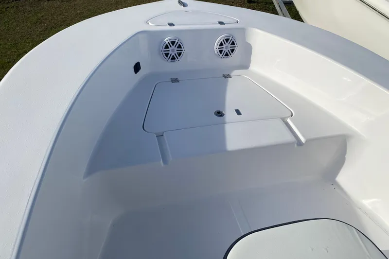 Slide: The Image of 2024 Tidewater 180 CC Adventure boat interior with storage compartment and speakers. - 3