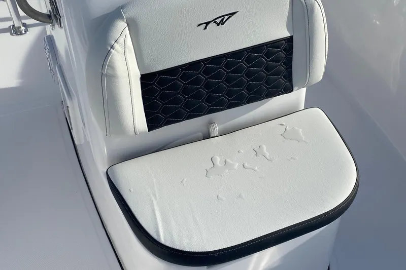 Slide: The Image of 2024 Tidewater 180 CC Adventure boat seat with white and black upholstery. - 5