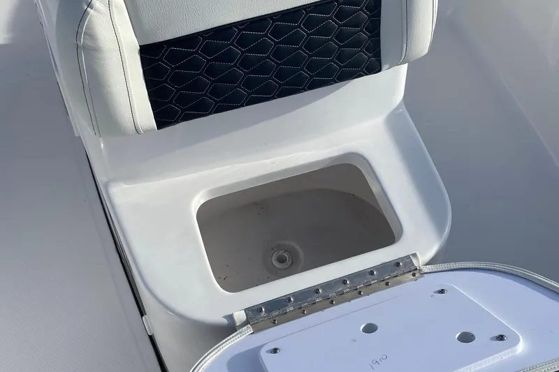 Slide: The Image of 2024 Tidewater 180 CC Adventure boat seat with storage compartment open. - 6