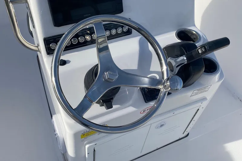 Slide: The Image of Steering console of 2024 Tidewater 180 CC Adventure boat with modern controls. - 7
