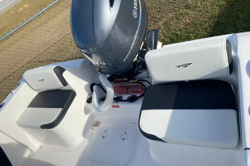 Slide: The Image of 2024 Tidewater 180 CC Adventure boat interior with Yamaha engine and seating. - 8